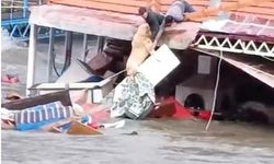 Bir saniye bile düşünmedi, köpeğini selden böyle kurtardı