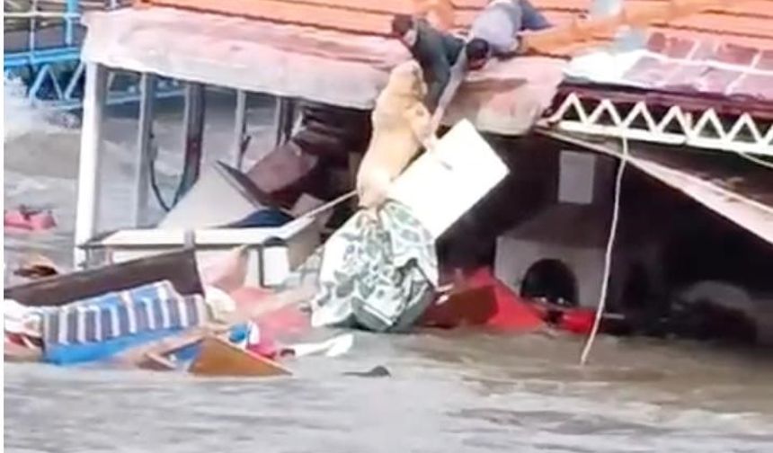 Bir saniye bile düşünmedi, köpeğini selden böyle kurtardı