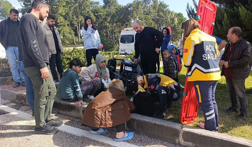 Motorlu bisiklet takla attı, 2 kişi yaralandı